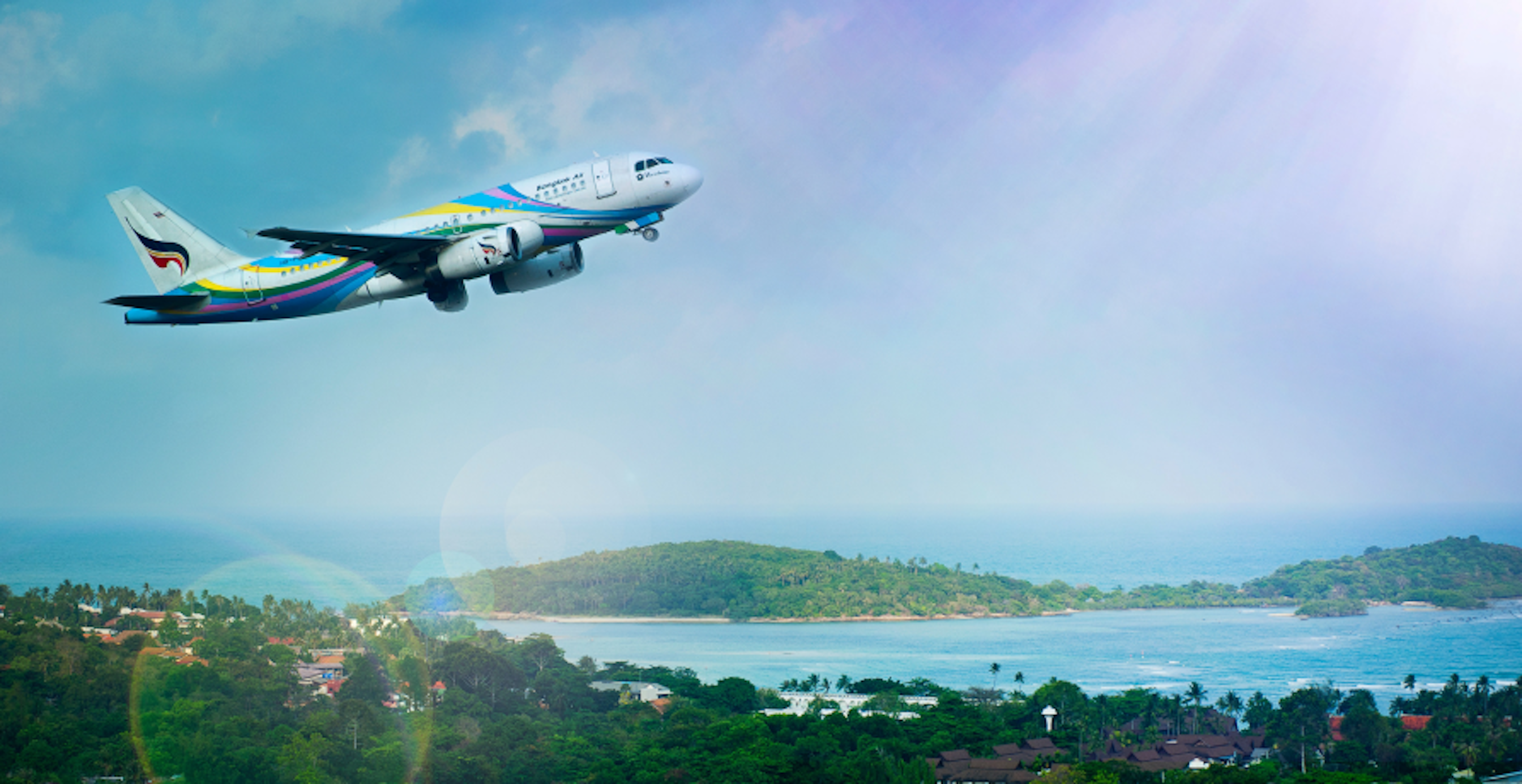 plane flying over island
