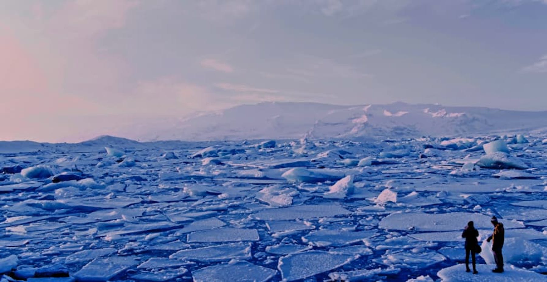 people standing on broken ice