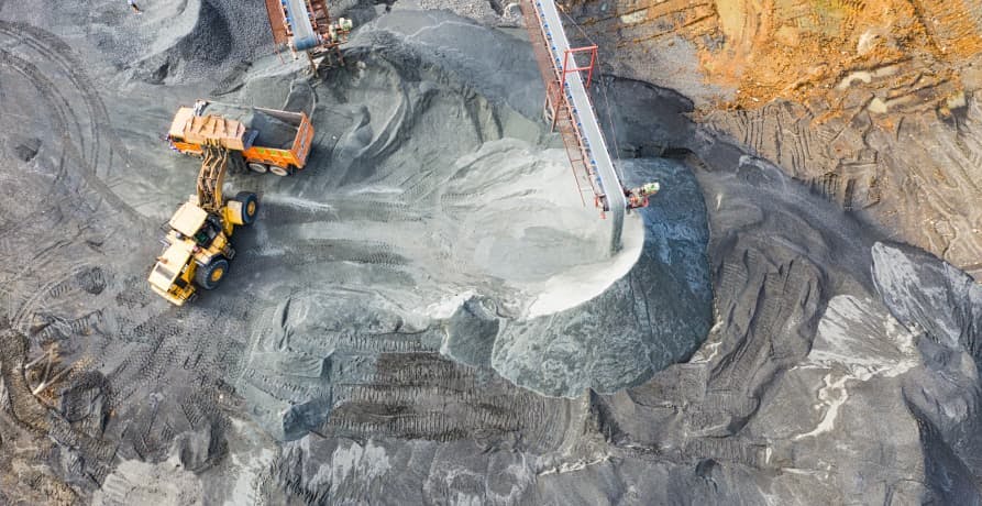 arial shot of a quarry with diggers and heavy vehicles working