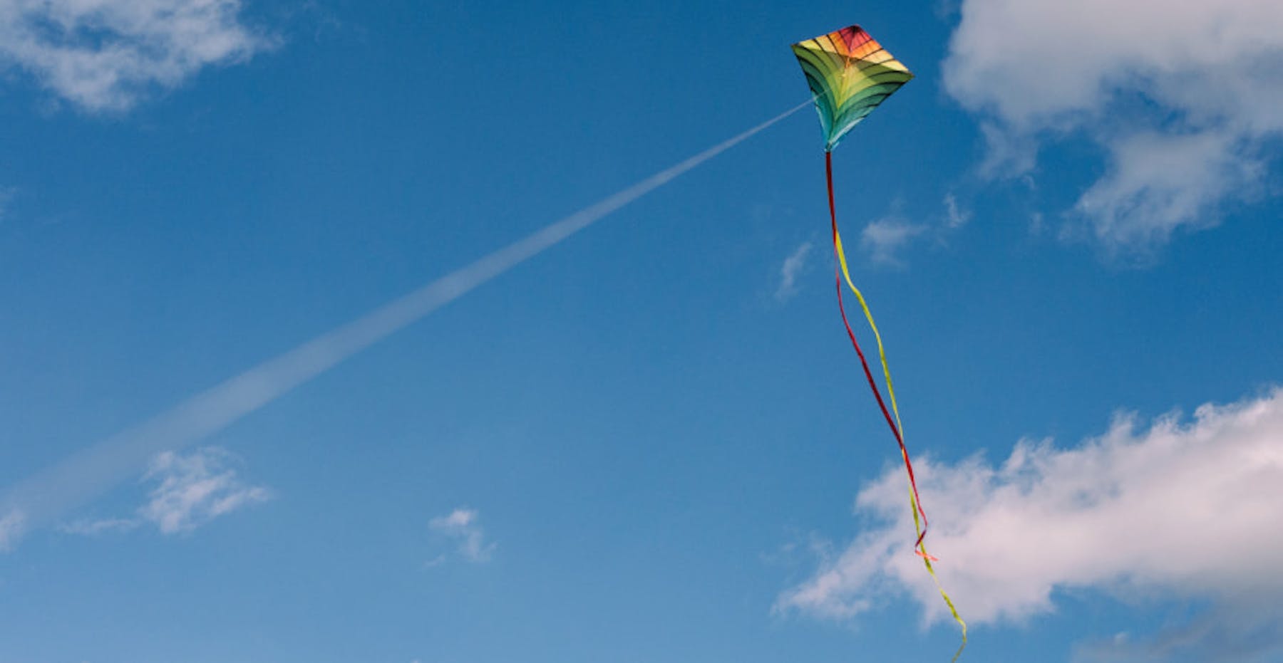 person flying kite in the sky