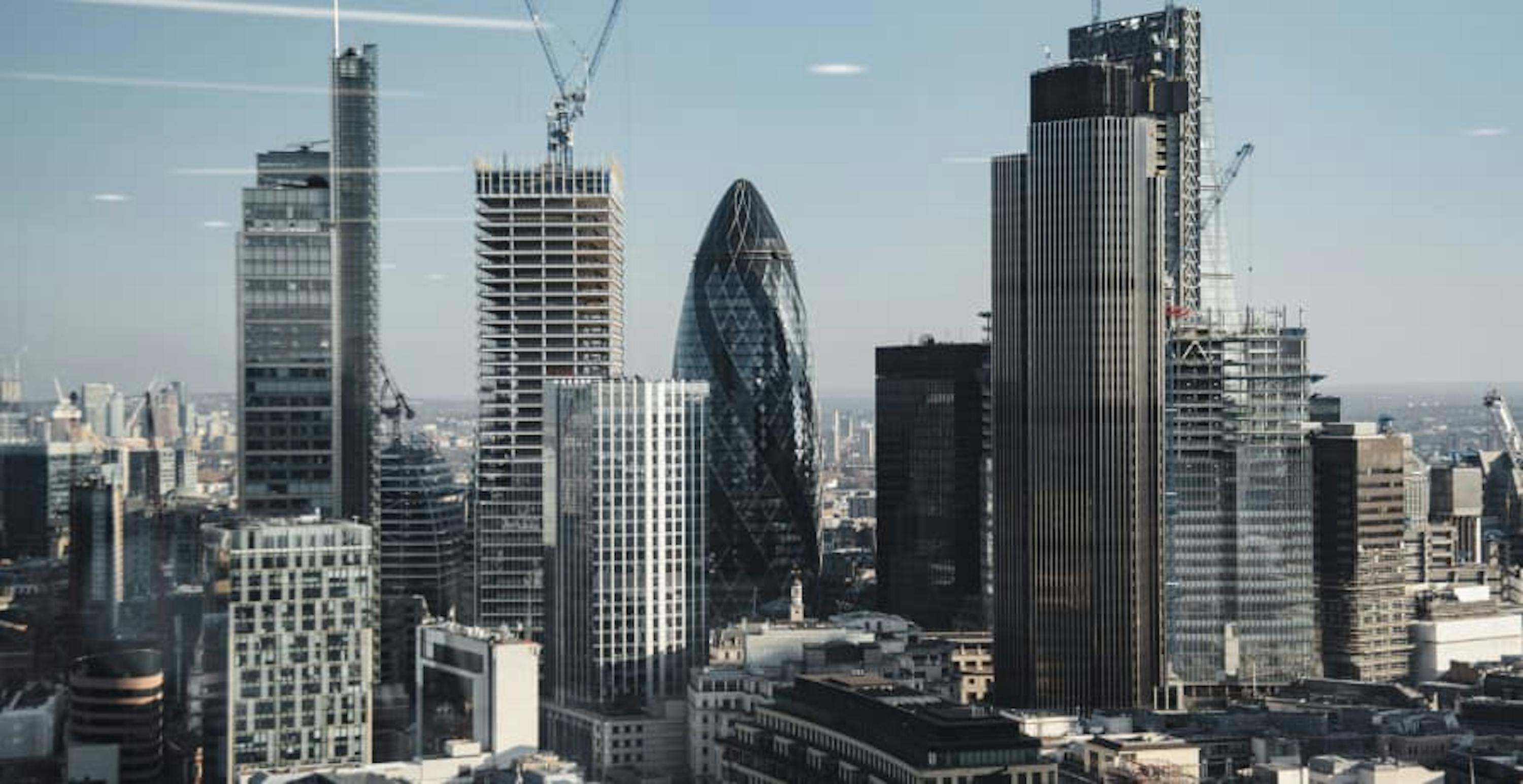 London City skyline with lots of skyscrapers against a blue sky