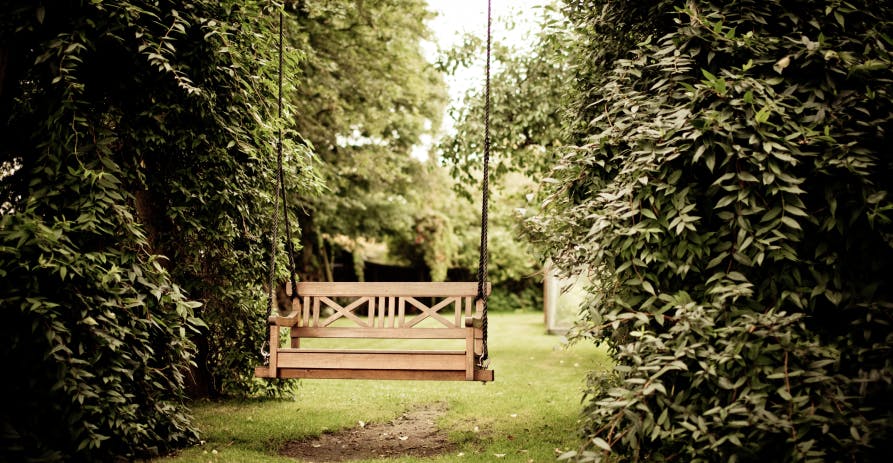 swinging bench in a garden