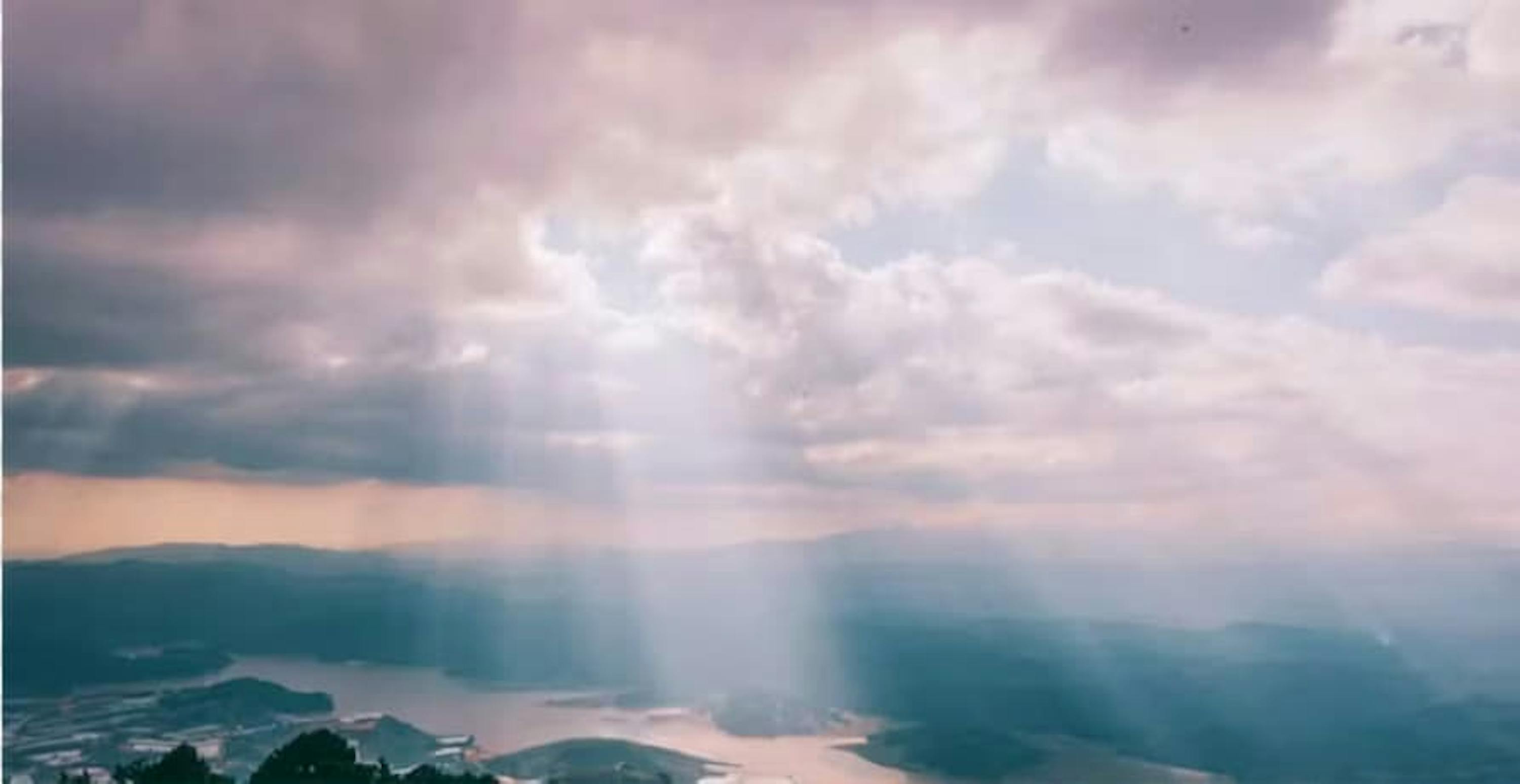 Landscape light rays through clouds 