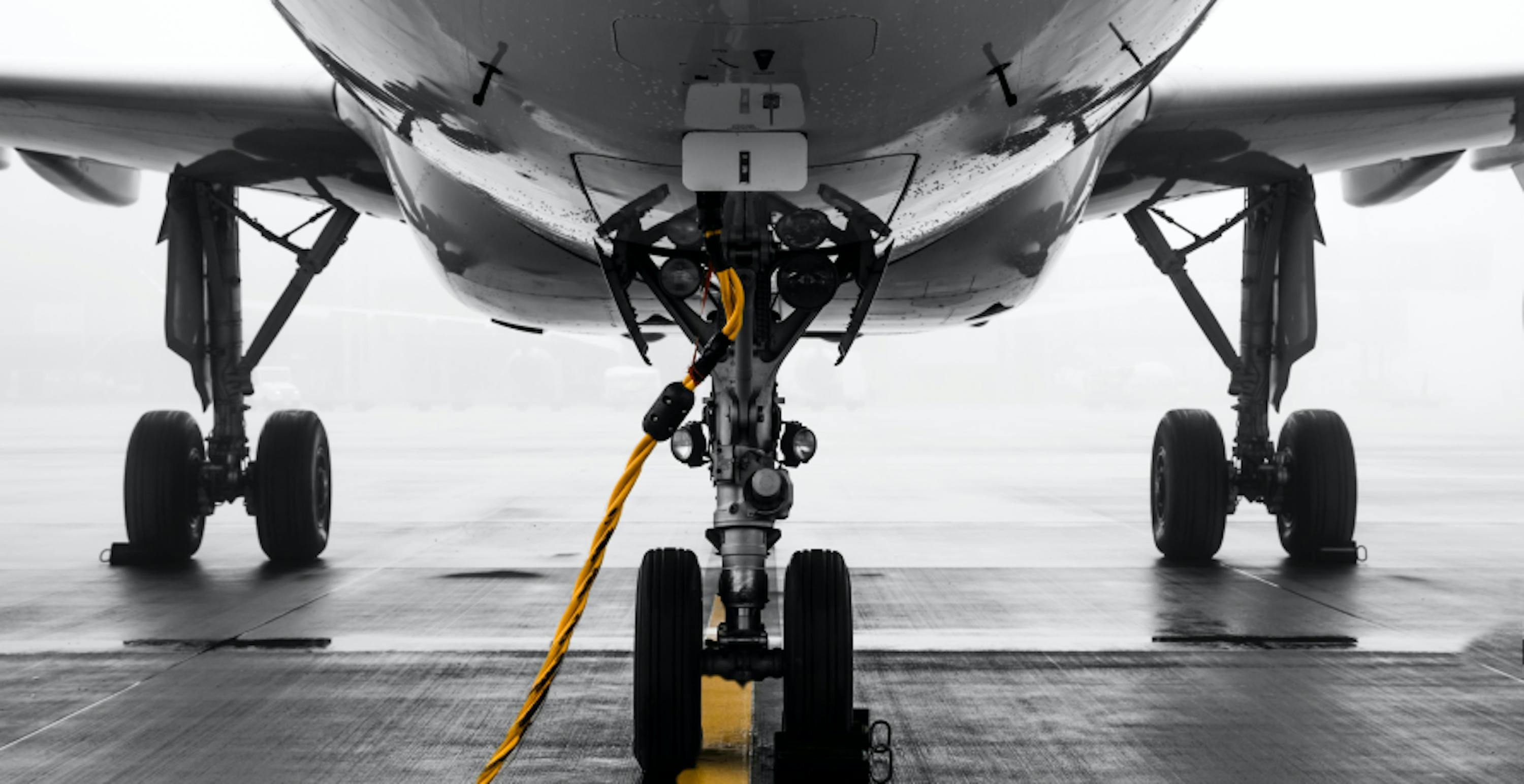 plane being fuelled on tarmac 