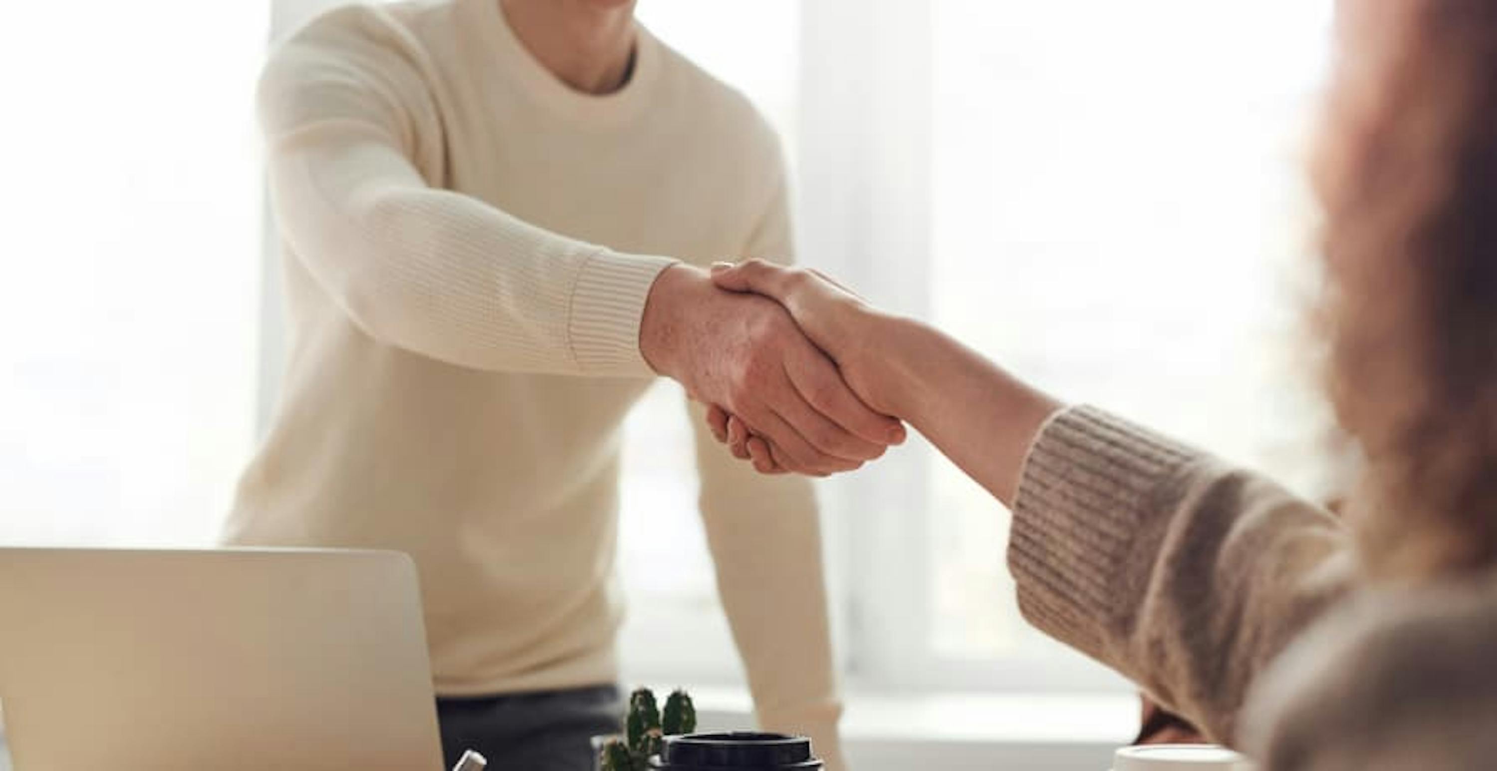 two people shaking hands