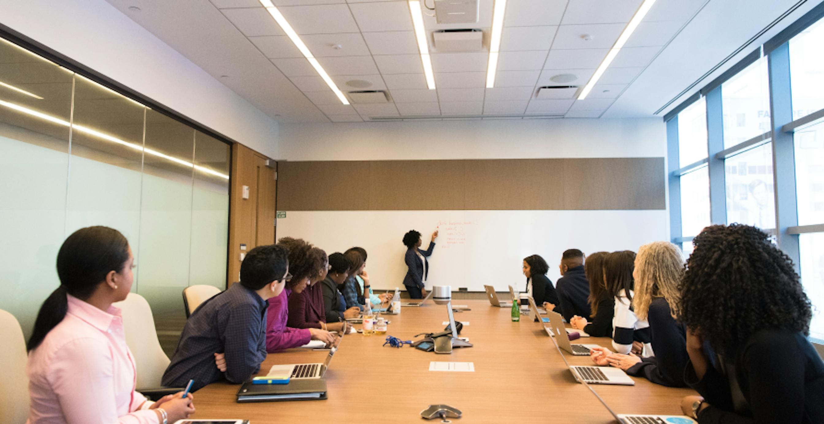 board room meeting with lots of employees