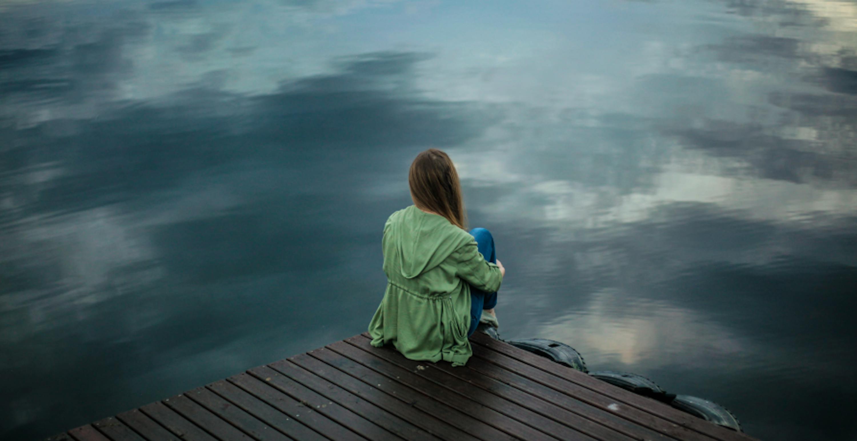 anxious girl on waters edge