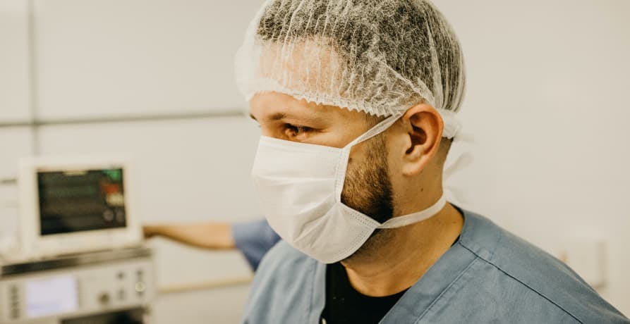 doctor wearing face mask and hair mask