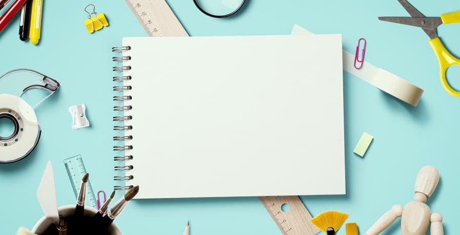 back to school supplies and giant blank white notepad