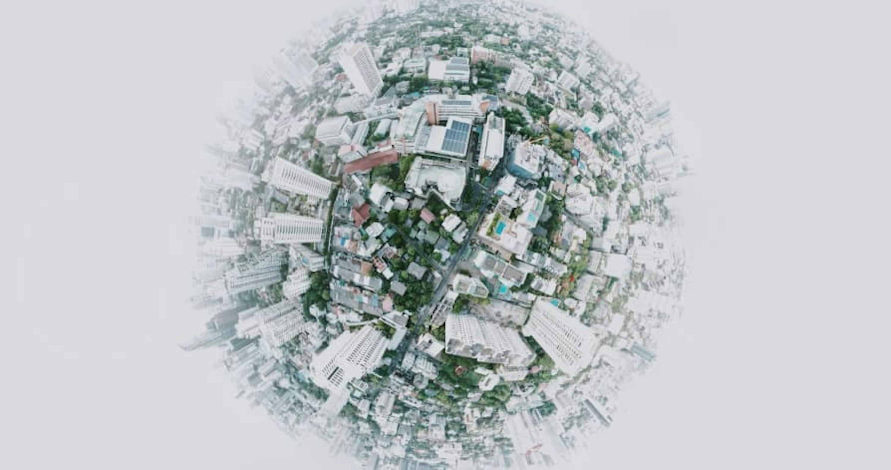 spherical muted globe with buildings, green areas, and solar panels