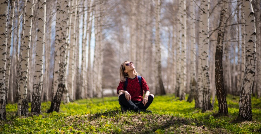 person looking up in nature