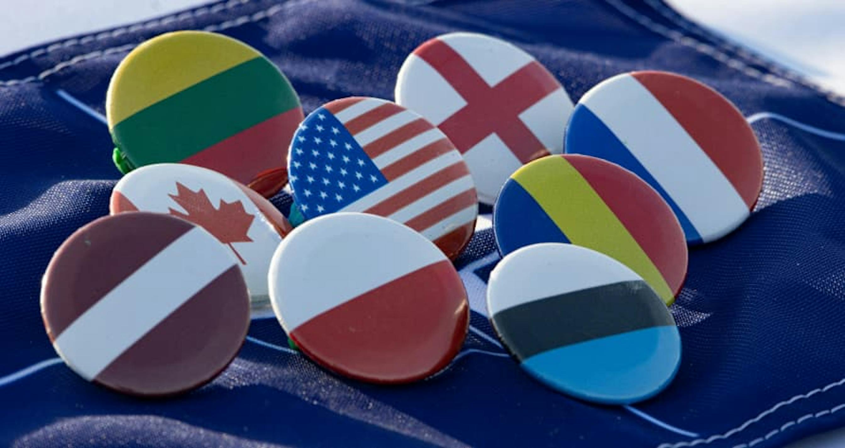 country pins in NATO on blue cloth