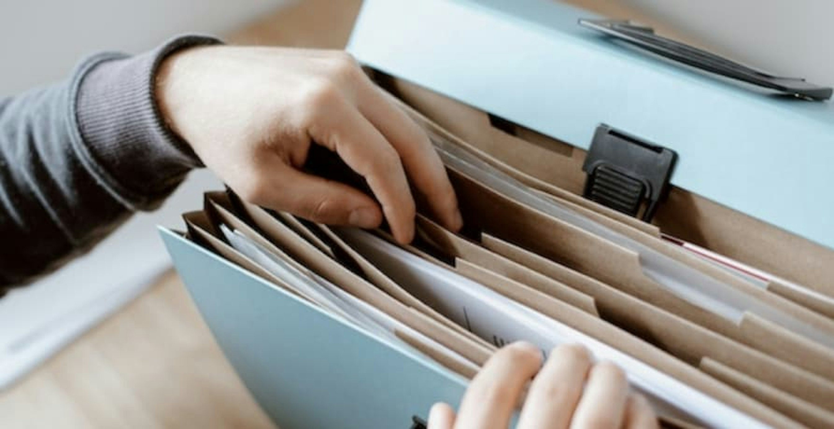 person going through file cabinet