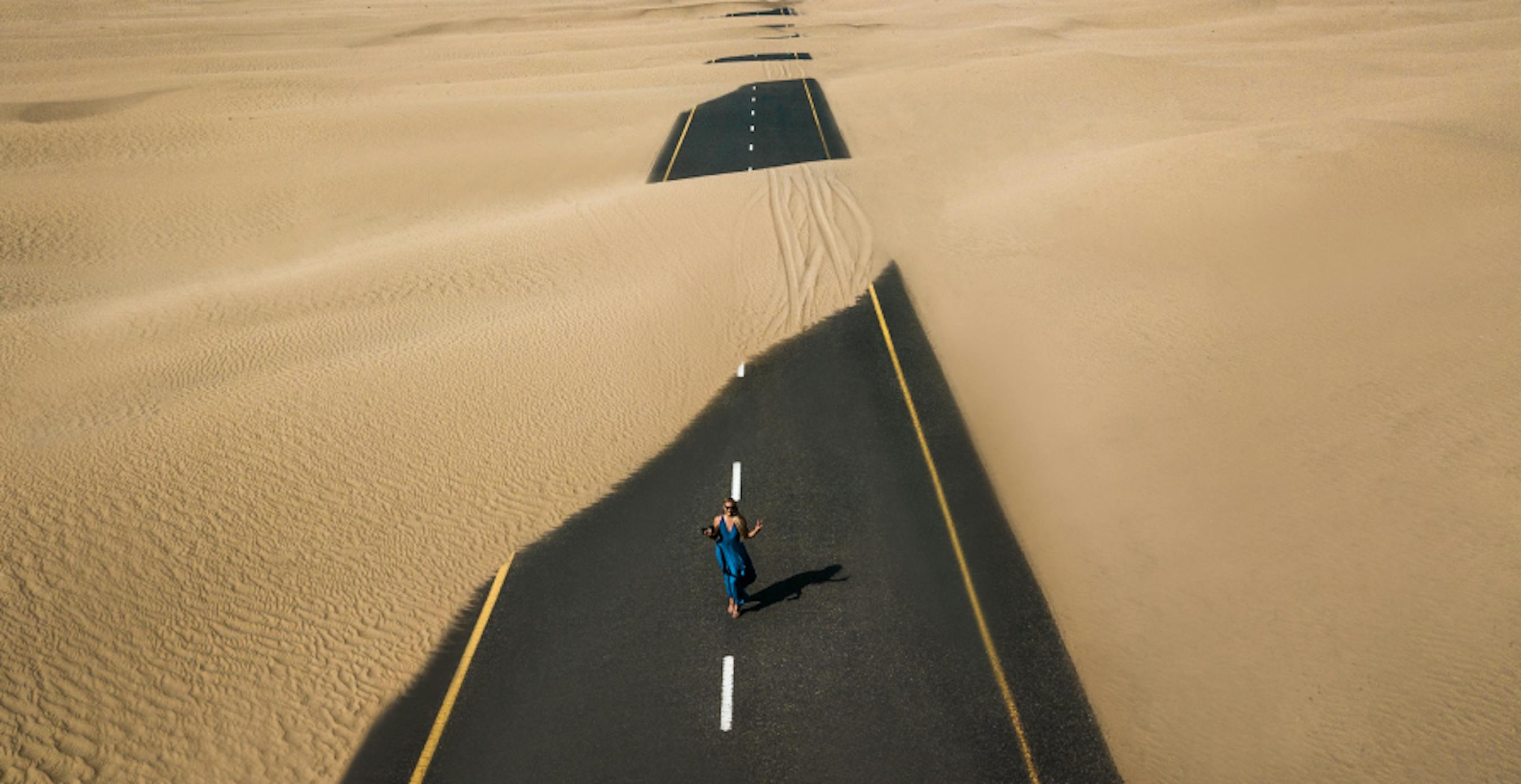 sandy road in desert 