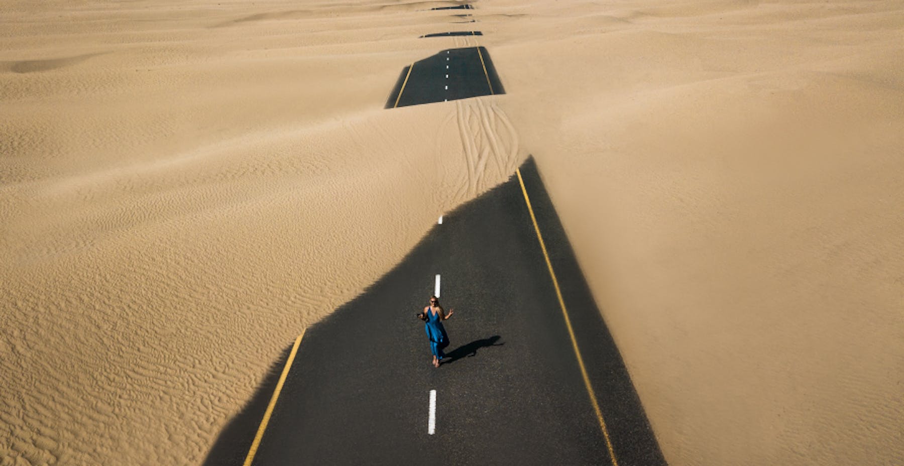 sandy road in desert 