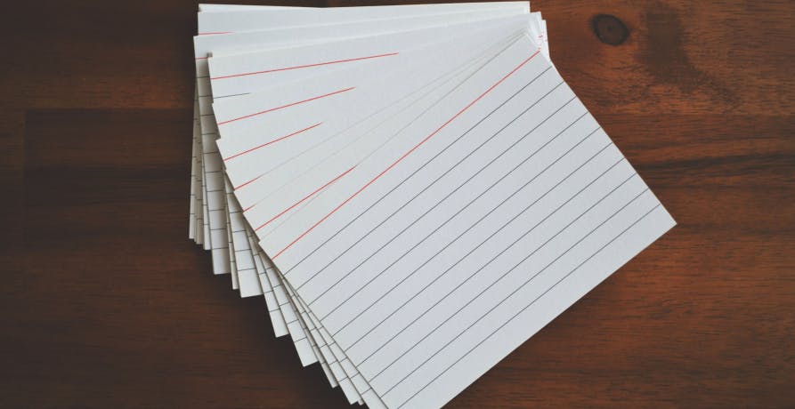 notecards on wood table surface
