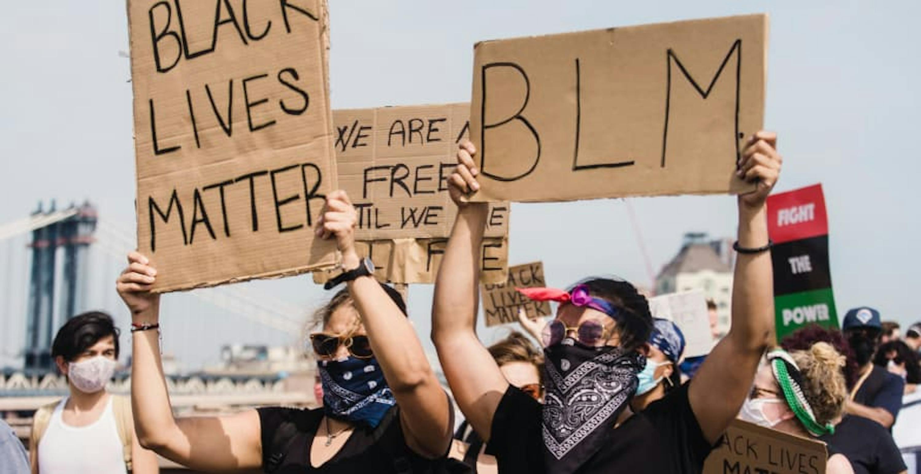 Black Lives Matter protesters holding up signs