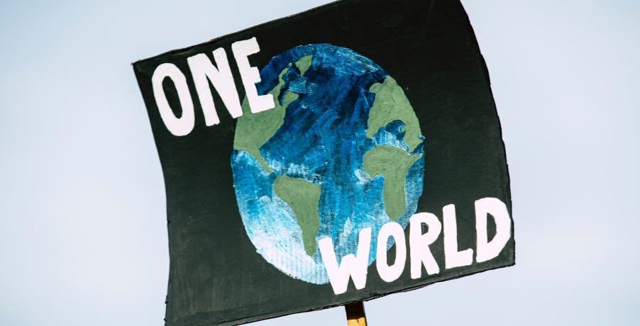 poster with earth that says, "one world"