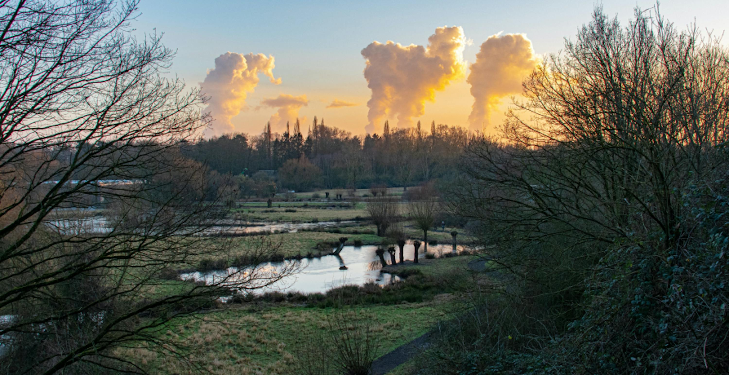 countryside with city and pollution visible in distance