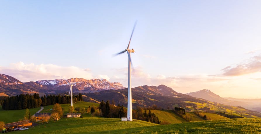 Wind turbines in countryside landscape