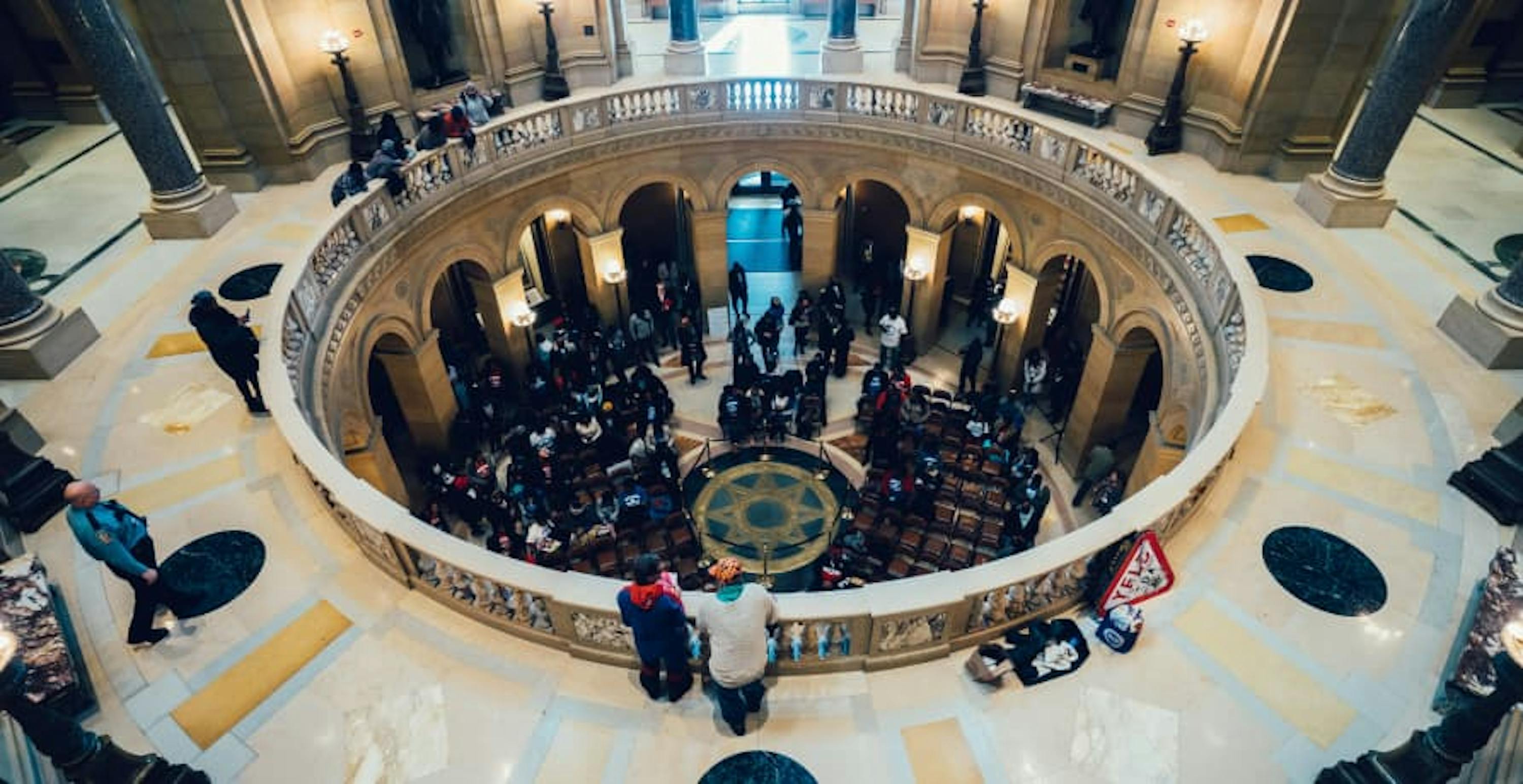 inside of a government building with people meeting