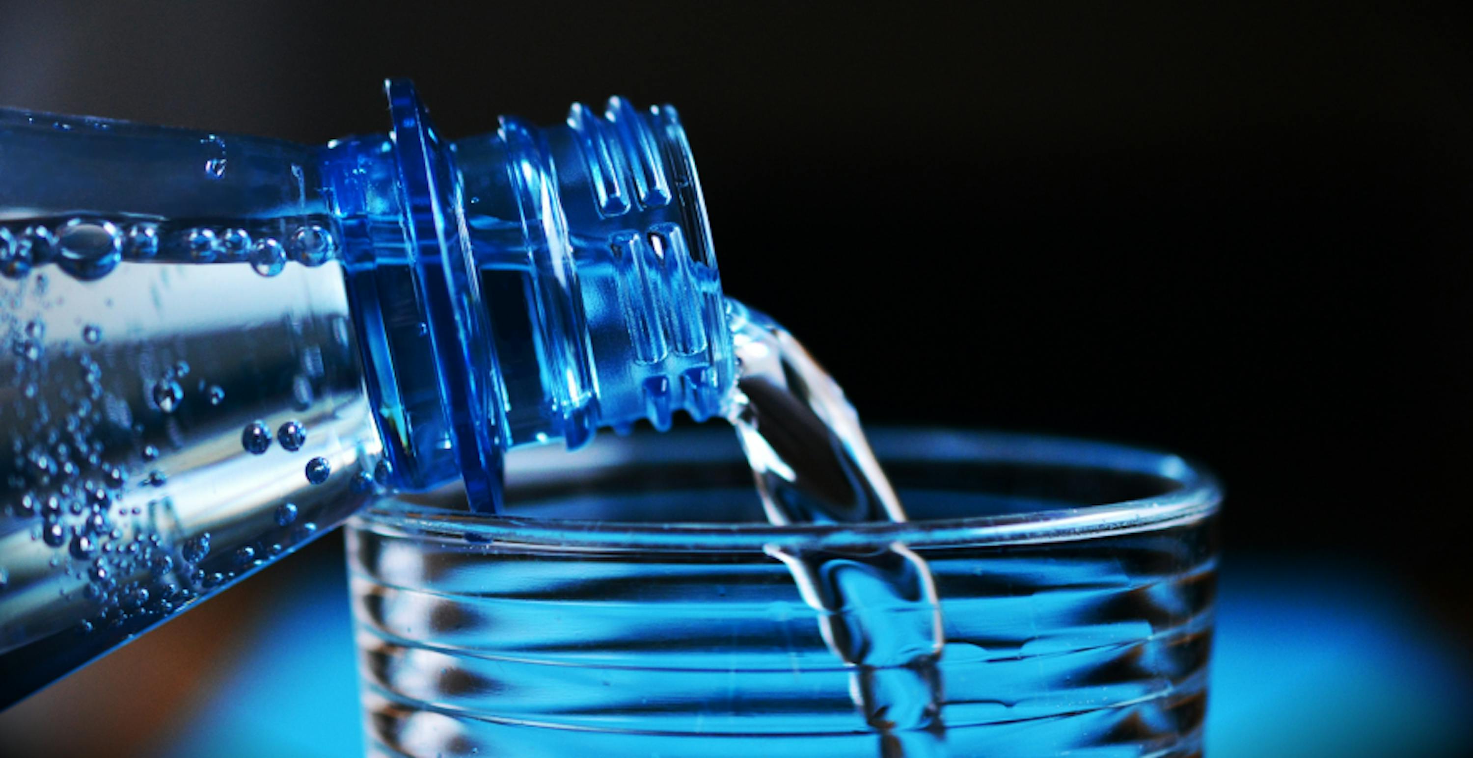 pouring water into a glass