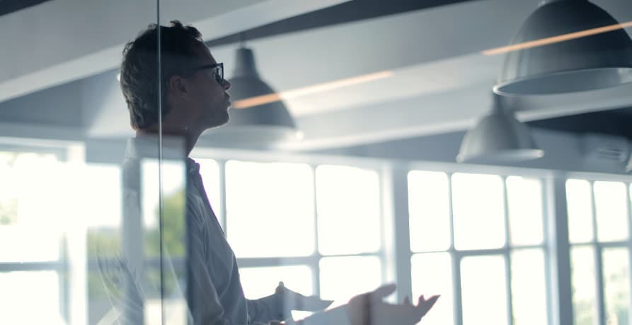 man giving a presentation in an office