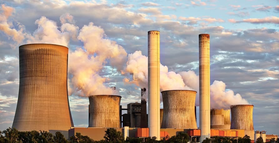 large power plant releasing emissions into the air