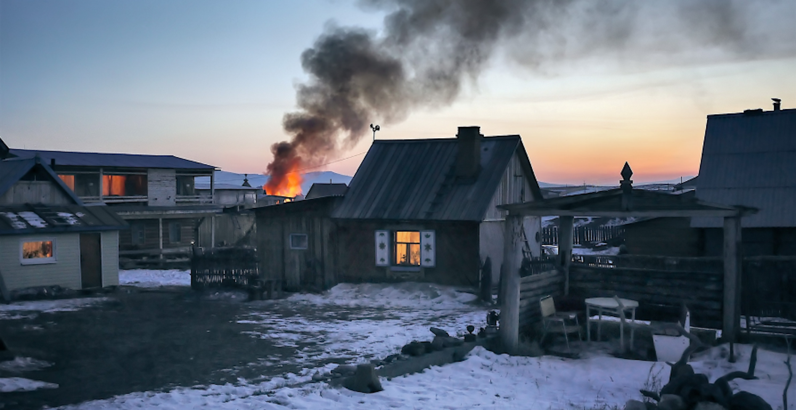 house on fire in snowy weather