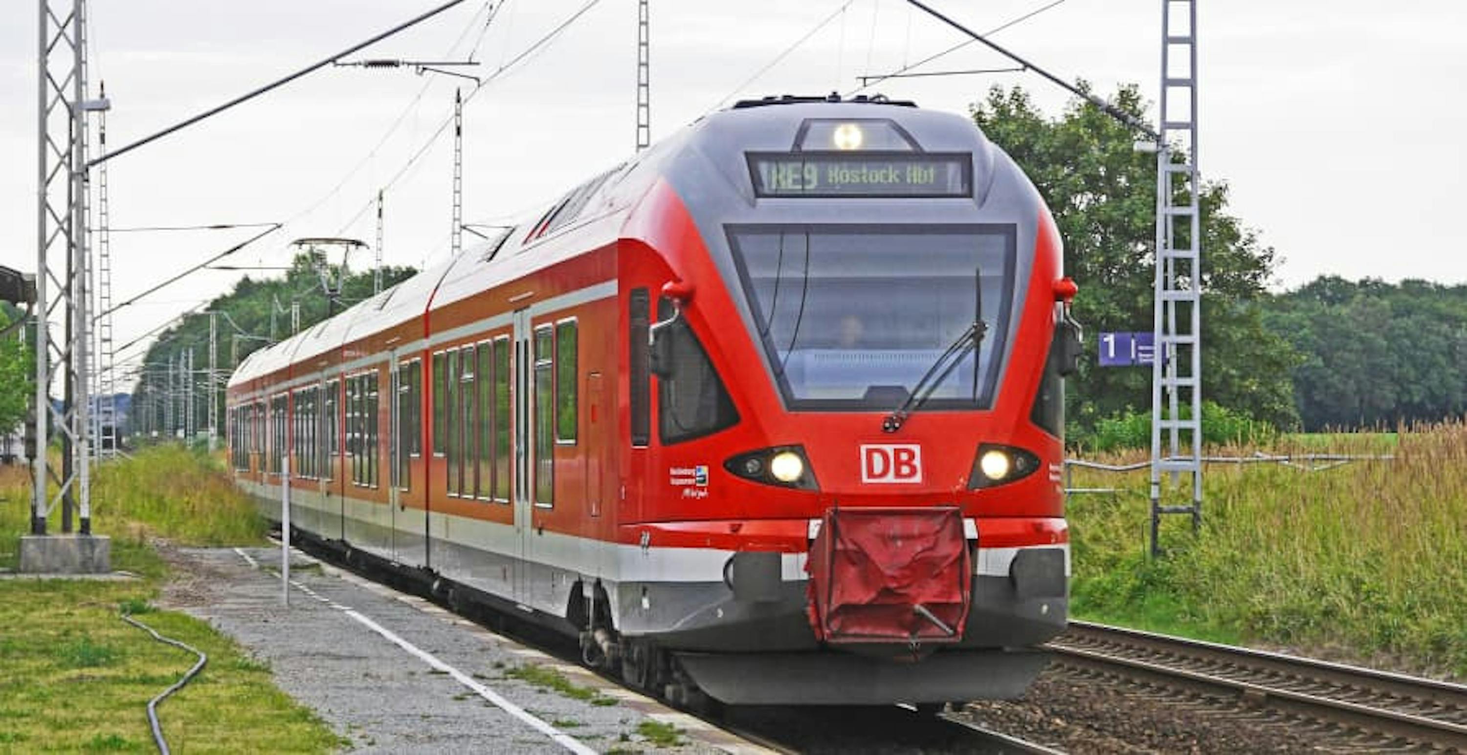 electric train driving through the countryside