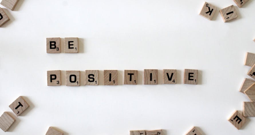 a message that reads 'be positive'