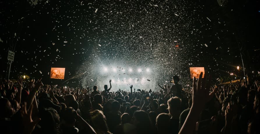 indoor crowd with confetti at night