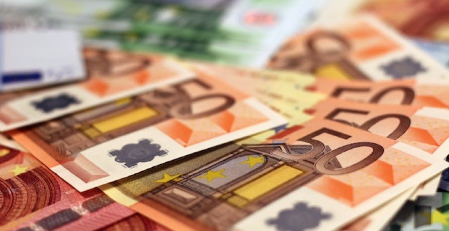 50 euro bills splattered across the table