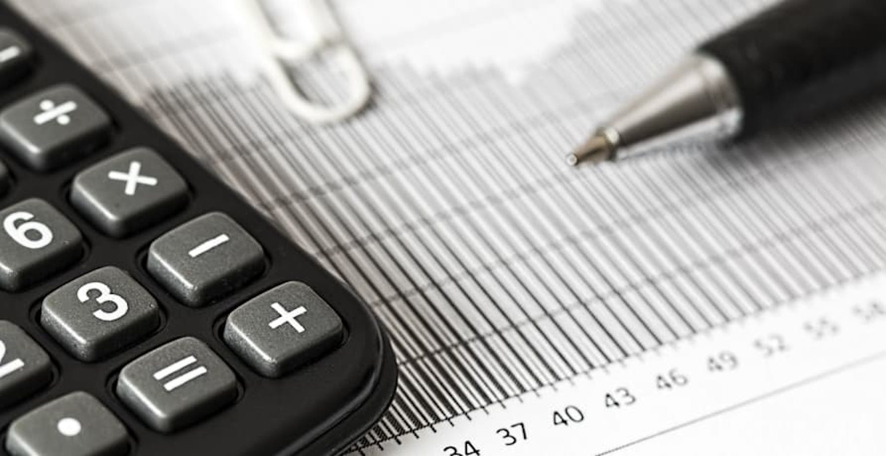 pen, paperclip, and calculator