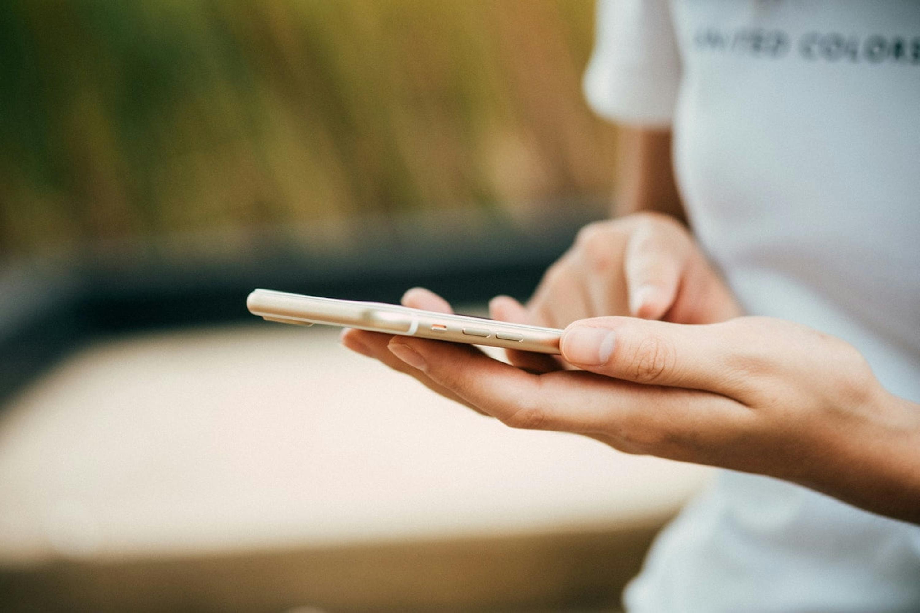 woman typing on her phone