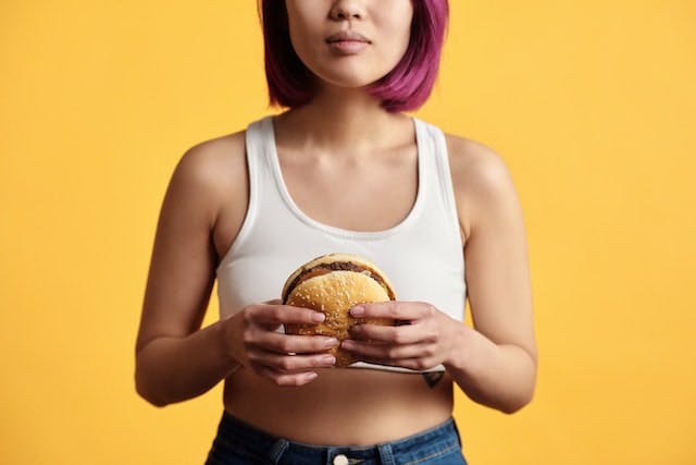 Woman eating a burger