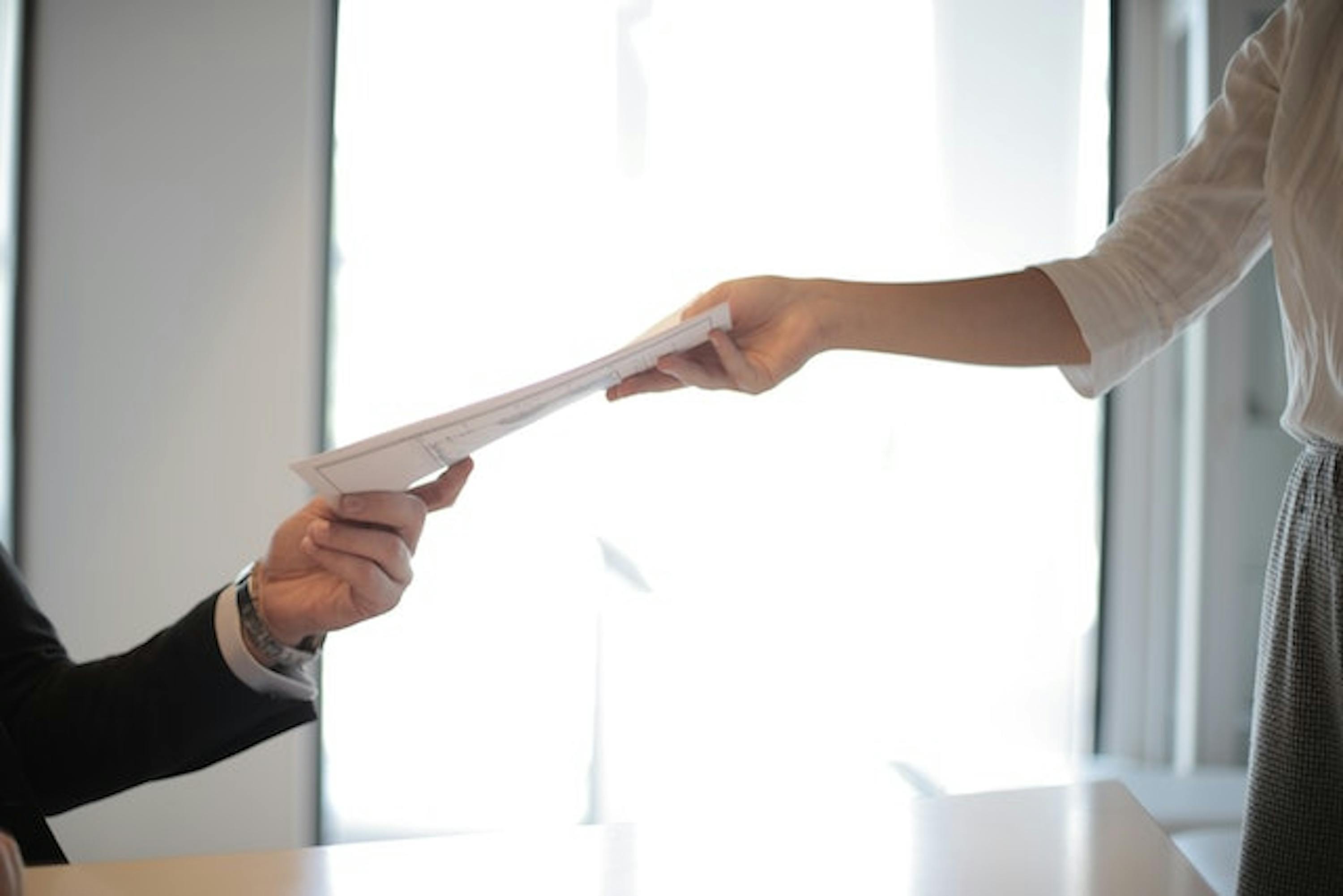 People holding document