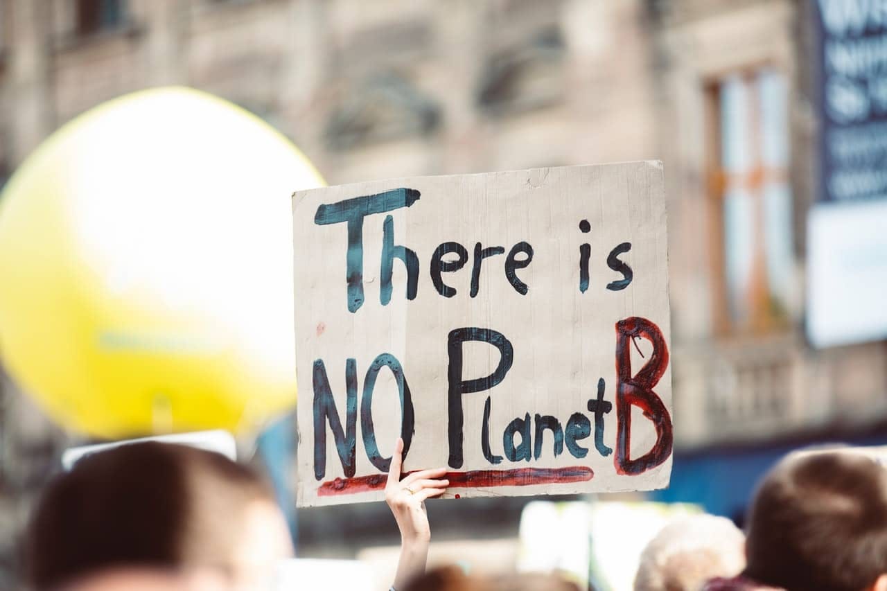 A sign with text there is no planet B