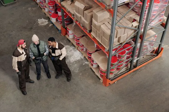 team checking supply chain planning in a warehouse