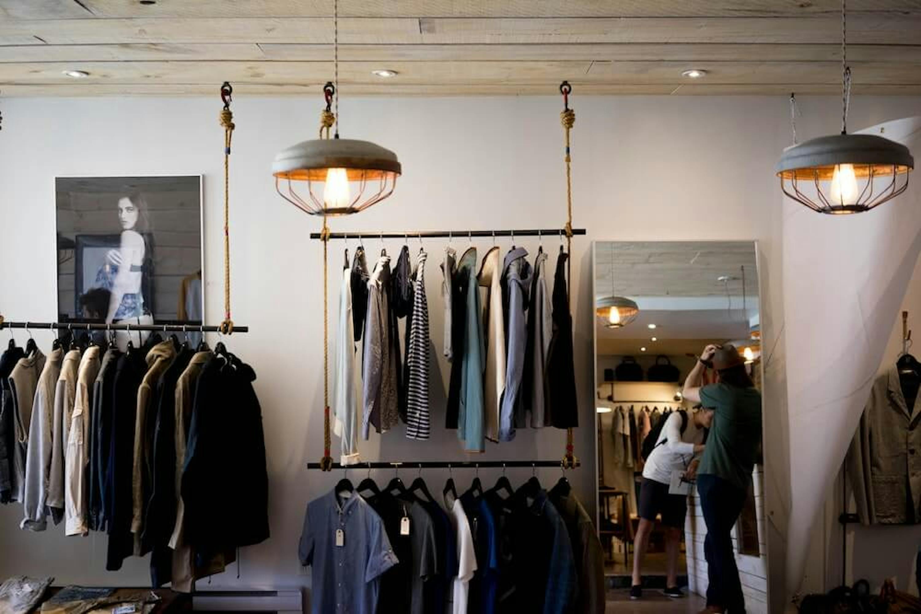 clothes hanging on shop railings