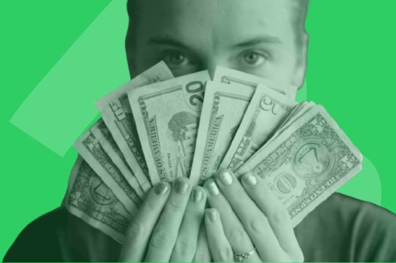 person holding USD bills