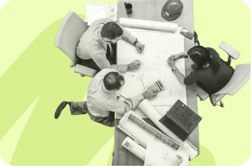 vue du dessus d'un groupe de travail autour d'une table, sur fond jaune