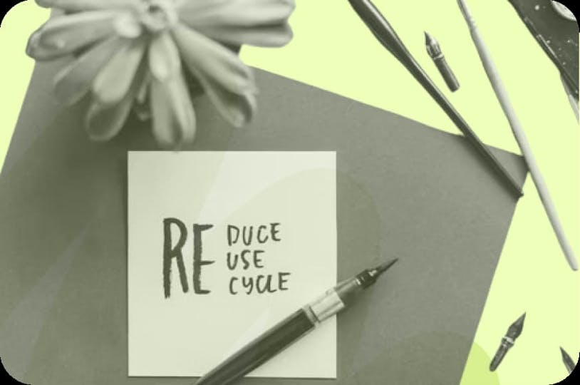 a paper that reads 'reduce, reuse, recycle'