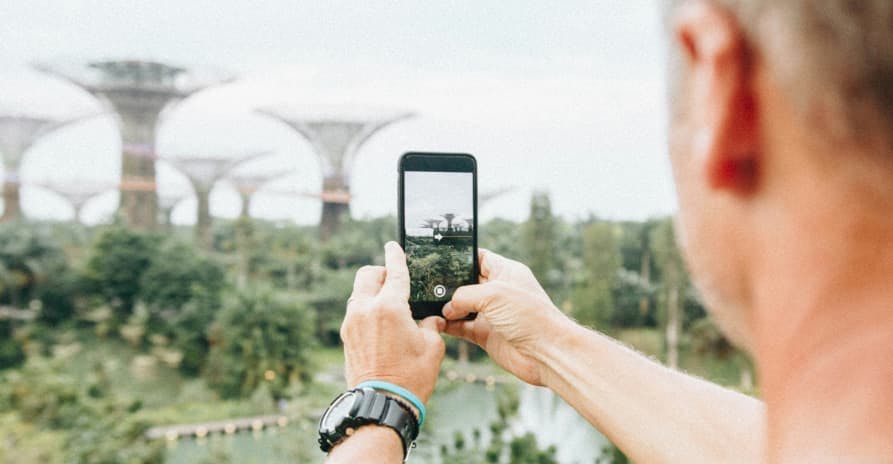 guy taking picture on his smartphone