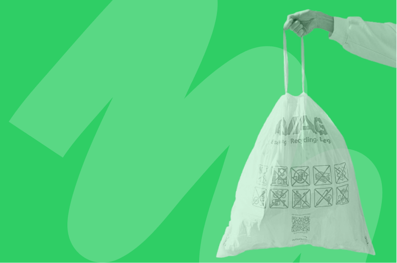 someone holding a recycling bag