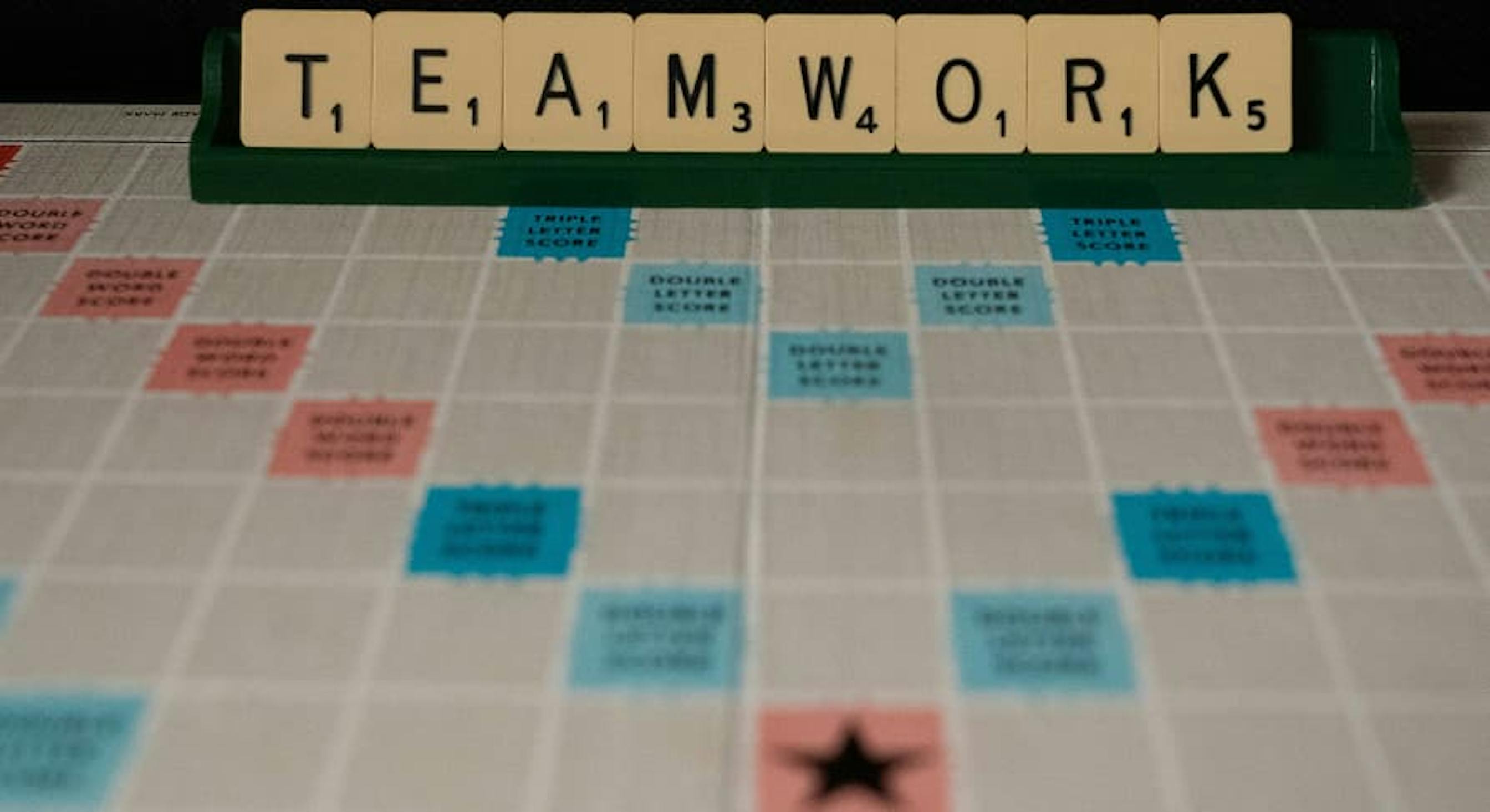 teamwork on a scrabble board