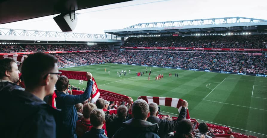 spectators cheering on a football team