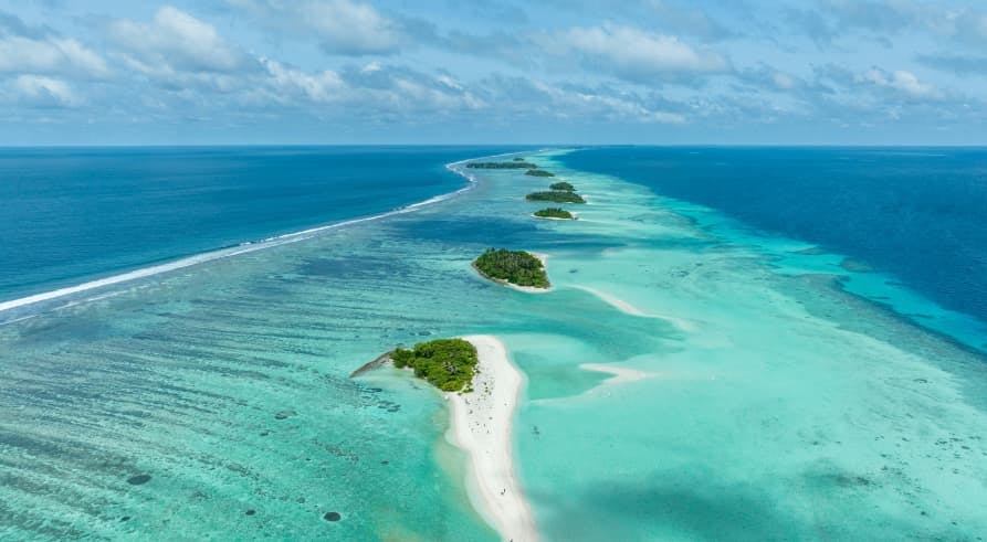 aqua water with pockets of green land