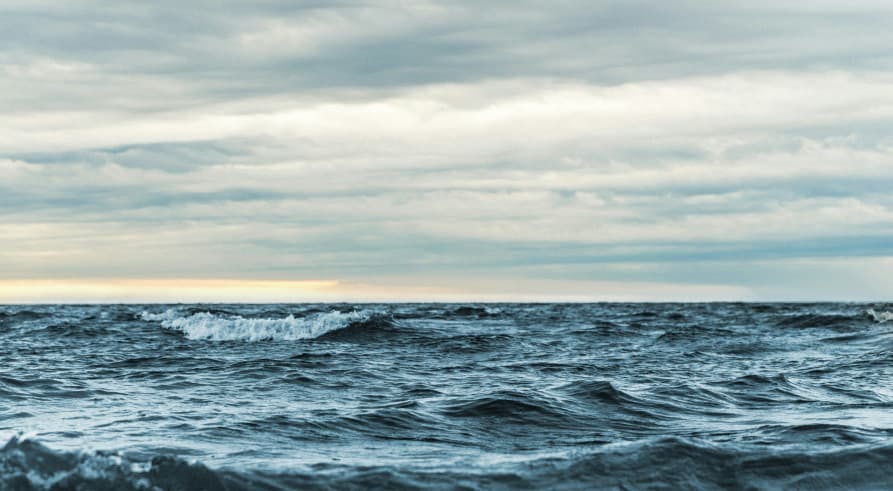 view of ocean and cloudy conditions