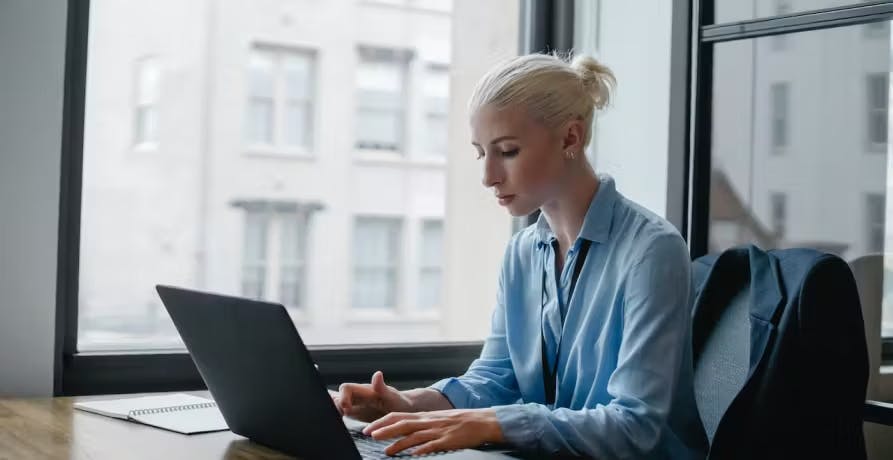 a woman who is working on laptop